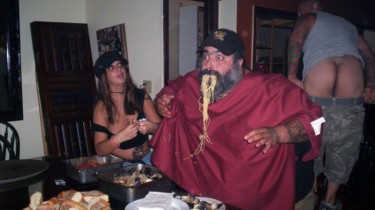 Incredibly Large Man Eating Pasta and Mussels Photobombed By Full Moon