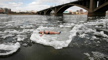 Woman in Siberia Sunbathing on a Floating Chunk of Ice