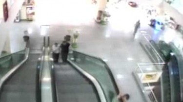hero catches boy from escalator