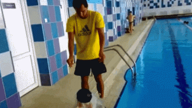 man puts on swim cap